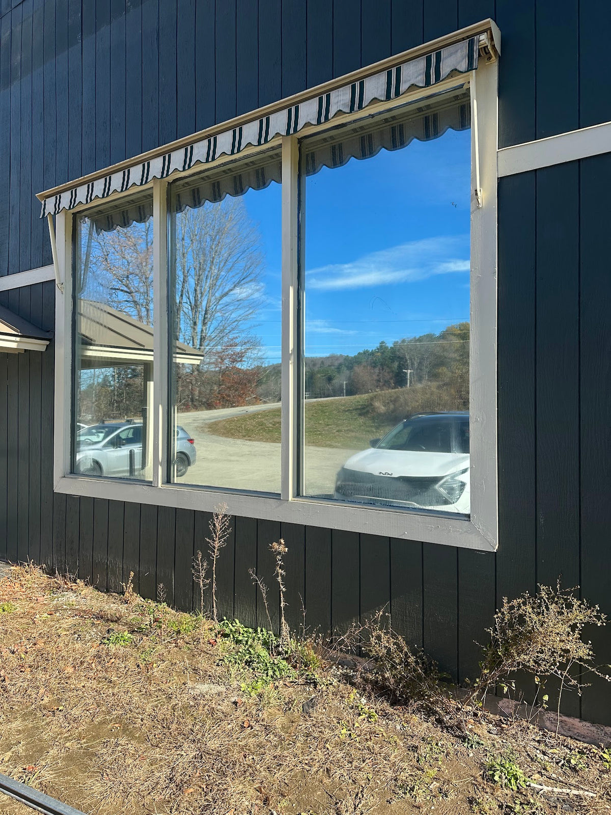 Finished reflective window film on large commercial windows, installed by Granite City Graphics